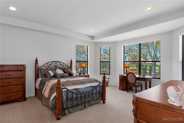 bedroom featuring recessed lighting, light carpet, and baseboards