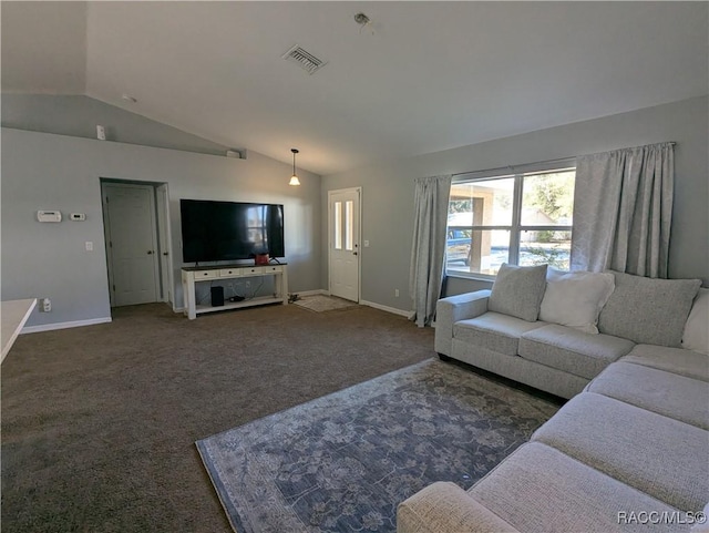 carpeted living room with vaulted ceiling