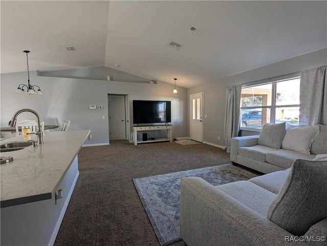 carpeted living room featuring lofted ceiling, a chandelier, and sink