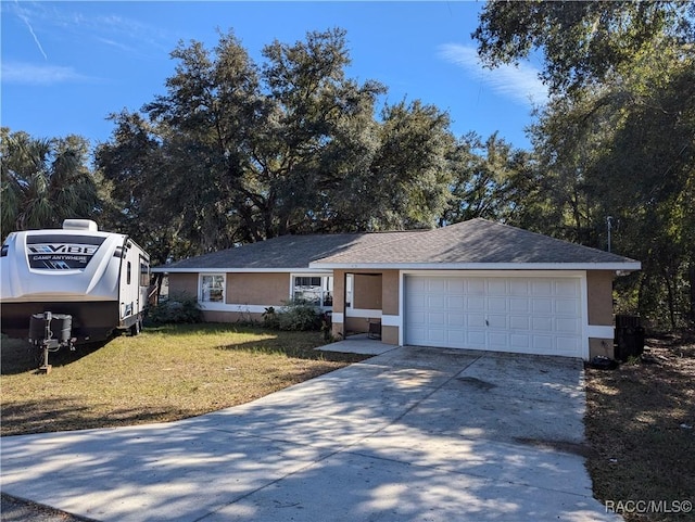 ranch-style home featuring a garage and a front yard