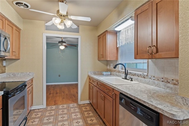 kitchen with ceiling fan, appliances with stainless steel finishes, and sink