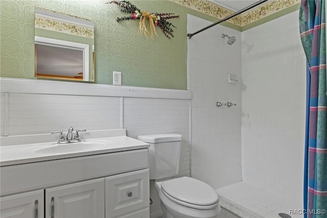 bathroom featuring vanity, a shower with curtain, and toilet