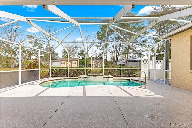 view of swimming pool featuring a patio, glass enclosure, fence, and a fenced in pool