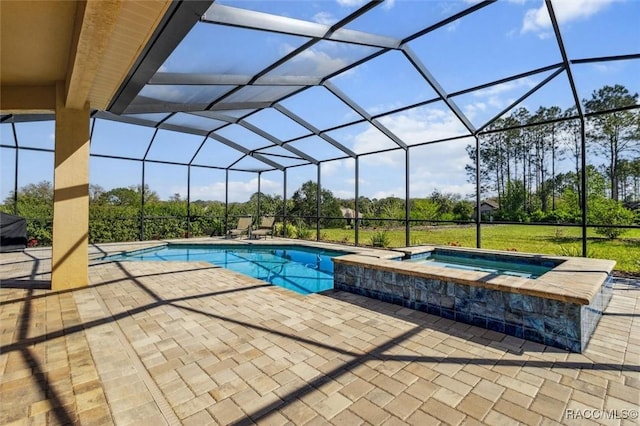 view of swimming pool featuring a lanai, a patio area, and a pool with connected hot tub