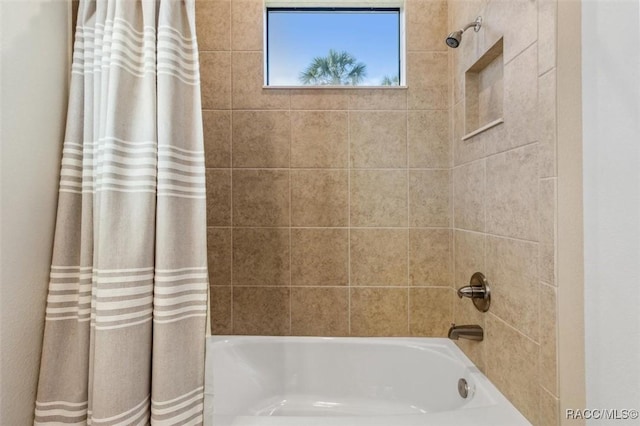 bathroom featuring shower / bath combination with curtain