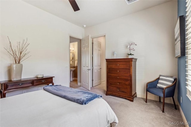 bedroom featuring ceiling fan, baseboards, and light colored carpet