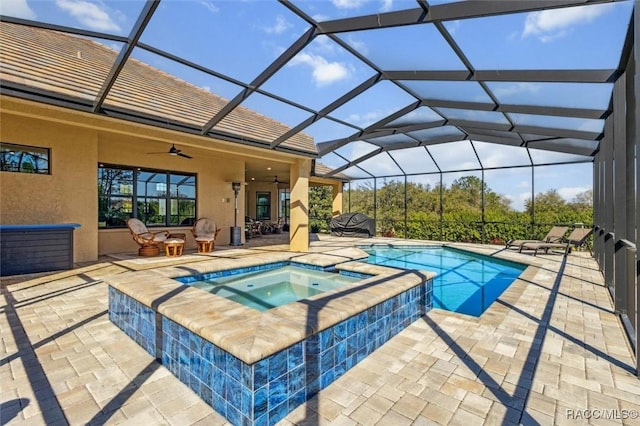 view of swimming pool featuring a patio area and glass enclosure