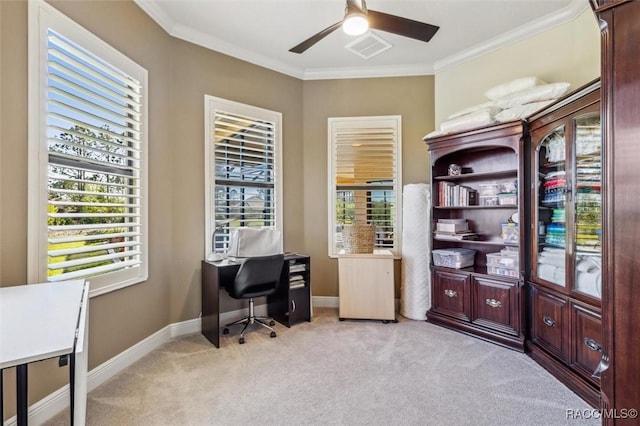 home office with light colored carpet, visible vents, baseboards, a ceiling fan, and crown molding