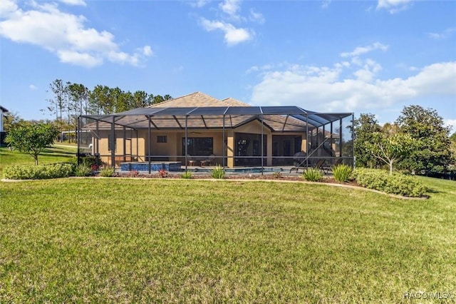 rear view of house featuring an outdoor pool, glass enclosure, and a yard