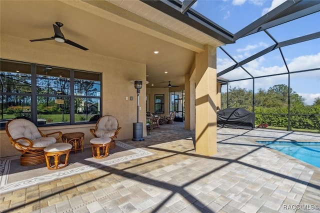 view of patio / terrace featuring an outdoor pool, a grill, glass enclosure, and ceiling fan