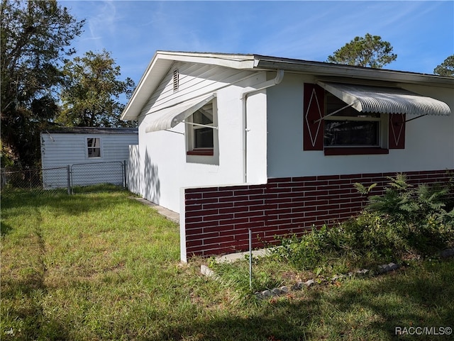 view of home's exterior featuring a yard