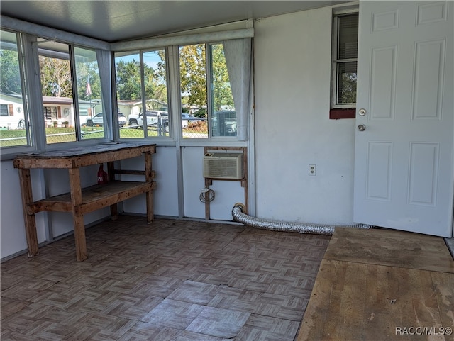 sunroom with an AC wall unit