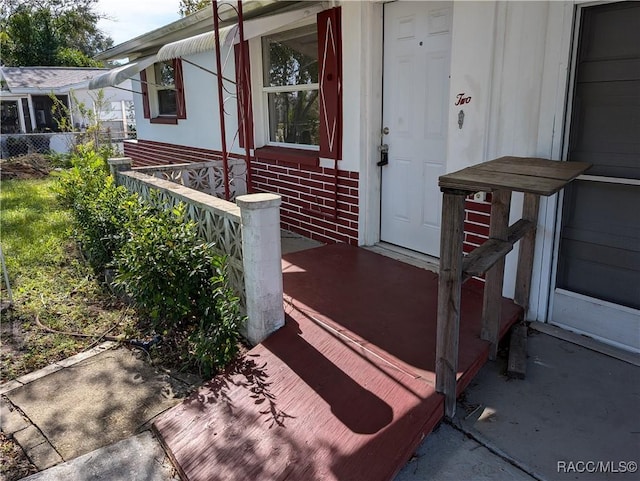 2 Plaza St, Beverly Hills, FL 34465 - entrance to property with brick siding and covered porch
