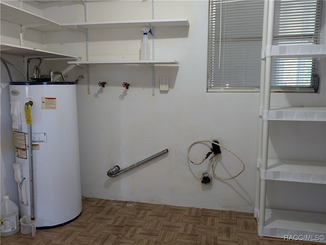 utility room with gas water heater