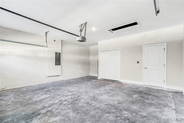 garage featuring electric panel and a garage door opener