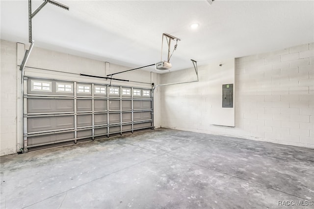 garage featuring electric panel and a garage door opener