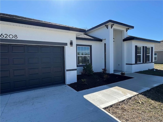 ranch-style home featuring a garage