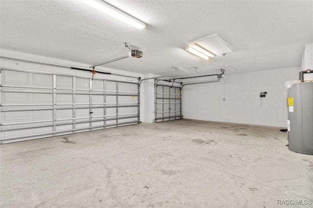 garage featuring a garage door opener and electric water heater