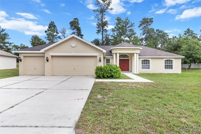 ranch-style house with a garage and a front yard