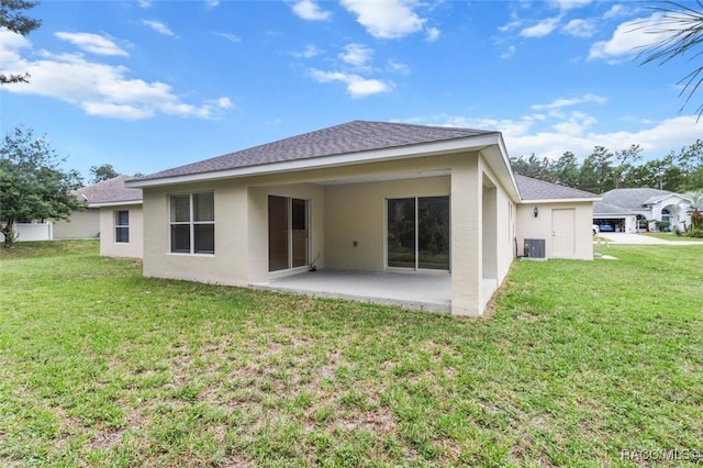 back of house with a patio, cooling unit, and a lawn