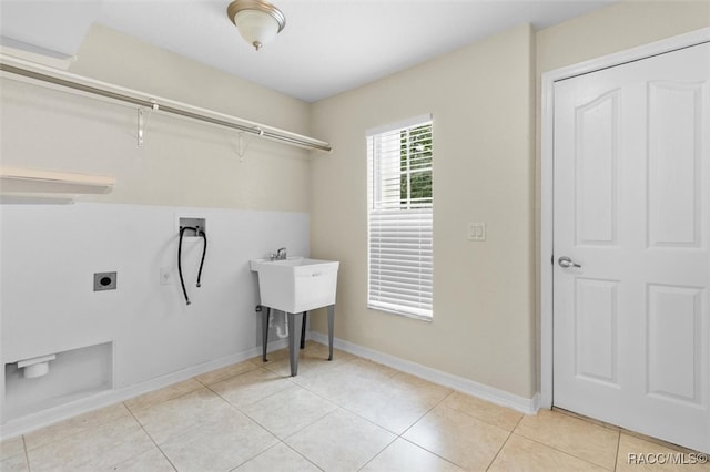 laundry area with light tile patterned floors, washer hookup, and hookup for an electric dryer