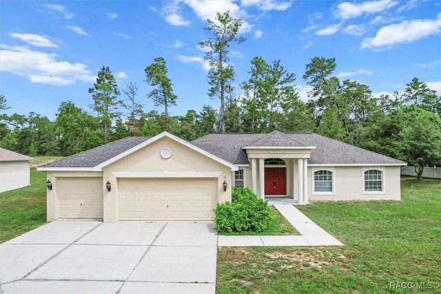 ranch-style house with a garage and a front lawn