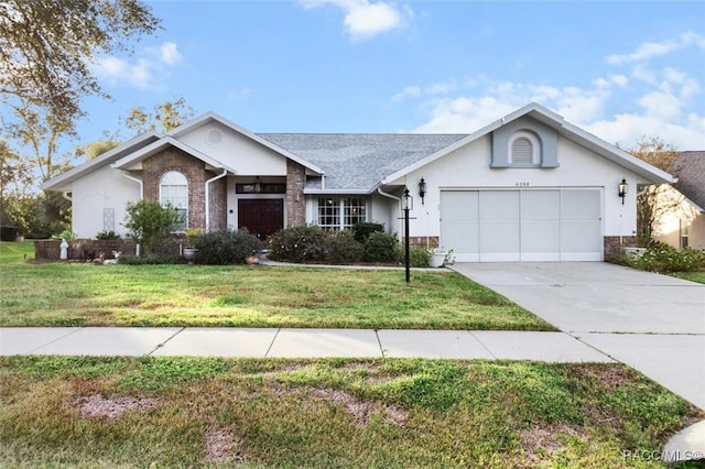 ranch-style home with a garage and a front yard