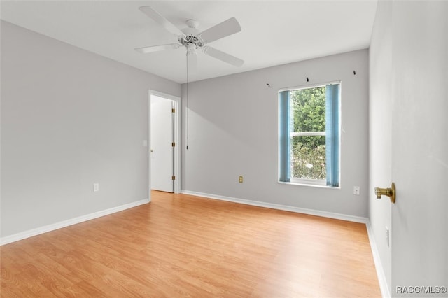 unfurnished room featuring ceiling fan and light hardwood / wood-style floors