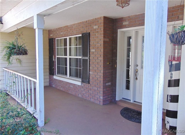 property entrance with covered porch