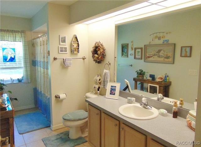 bathroom with toilet, vanity, tile patterned flooring, and curtained shower