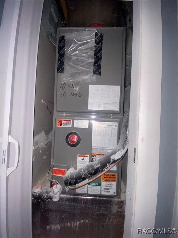 11 S Tyler St, Beverly Hills, FL 34465 - utility room with heating unit