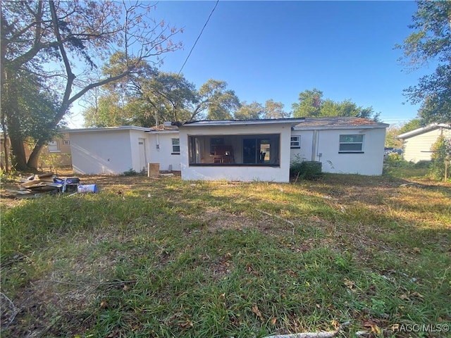 11 S Tyler St, Beverly Hills, FL 34465 - rear view of property featuring stucco siding