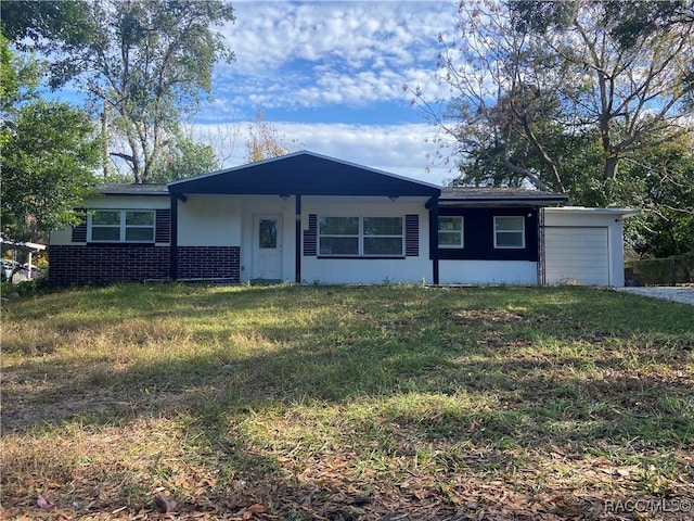 single story home with a garage and a front yard