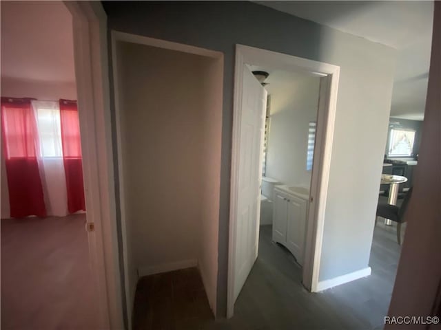 11 S Tyler St, Beverly Hills, FL 34465 - hallway featuring wood finished floors and baseboards