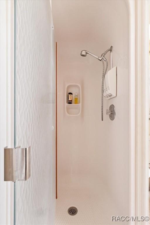 6150 N Whispering Oak Loop, Beverly Hills, FL 34465 - bathroom with a shower stall