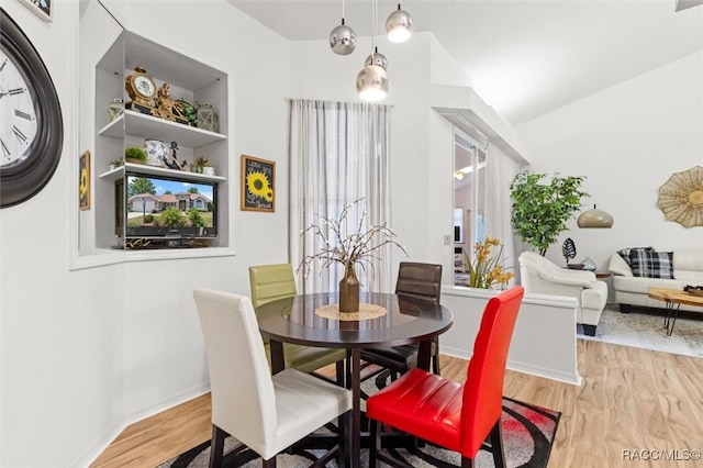 6150 N Whispering Oak Loop, Beverly Hills, FL 34465 - dining room with wood finished floors and baseboards