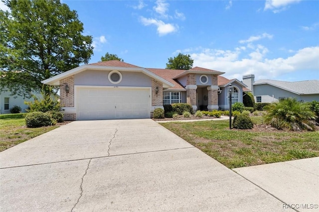6150 N Whispering Oak Loop, Beverly Hills, FL 34465 - view of front of property with brick siding, a garage, driveway, and a front lawn