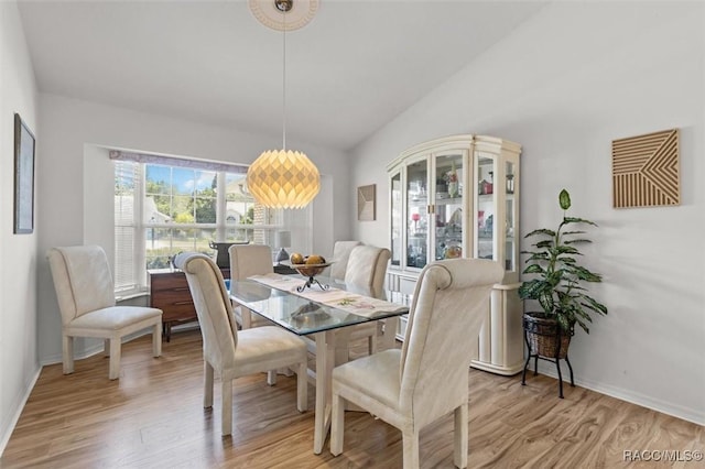 6150 N Whispering Oak Loop, Beverly Hills, FL 34465 - dining space with light wood-style flooring, baseboards, and vaulted ceiling