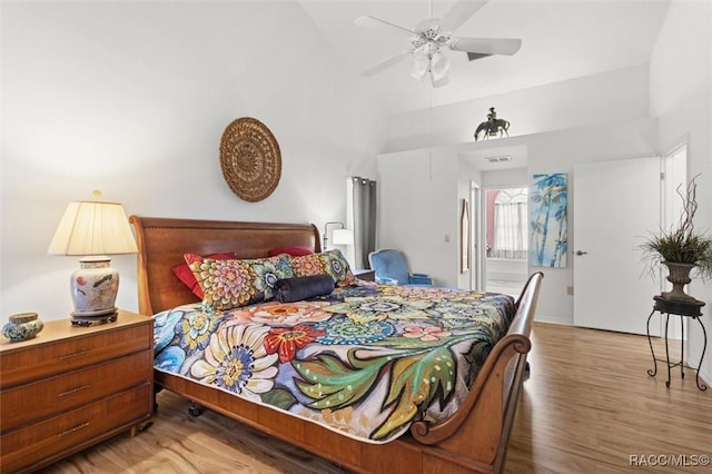 6150 N Whispering Oak Loop, Beverly Hills, FL 34465 - bedroom with high vaulted ceiling and wood finished floors