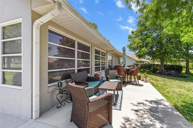 6150 N Whispering Oak Loop, Beverly Hills, FL 34465 - view of patio / terrace with outdoor dining space