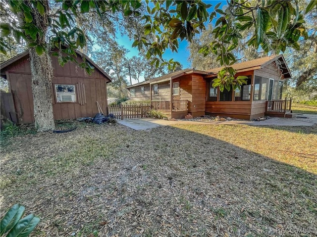 view of yard with a sunroom