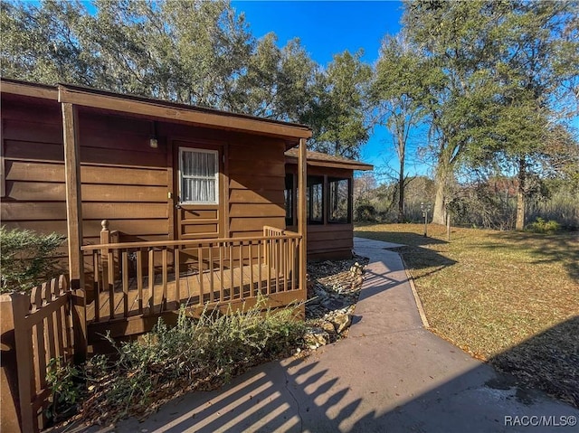 view of home's exterior featuring a yard