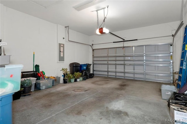 garage with electric panel and a garage door opener