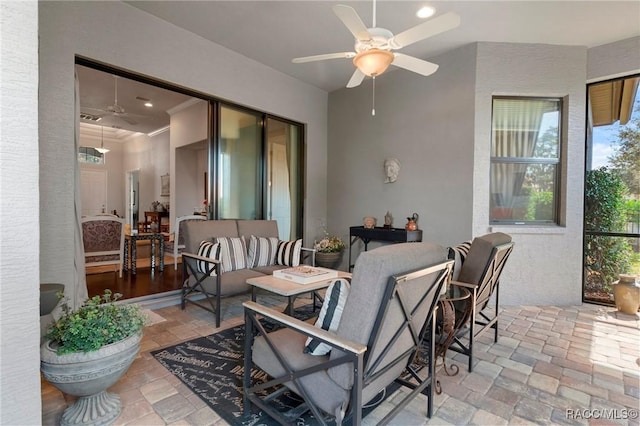 view of patio featuring an outdoor hangout area and a ceiling fan