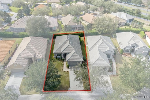 birds eye view of property with a residential view