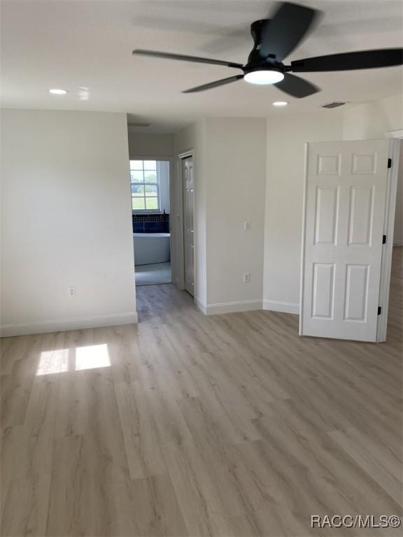 259 N Cherry Pop Dr, Inverness, FL 34453 - empty room featuring a ceiling fan, baseboards, and light wood-type flooring
