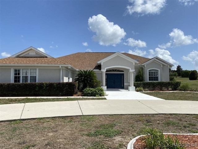 259 N Cherry Pop Dr, Inverness, FL 34453 - view of front of property with stucco siding and french doors