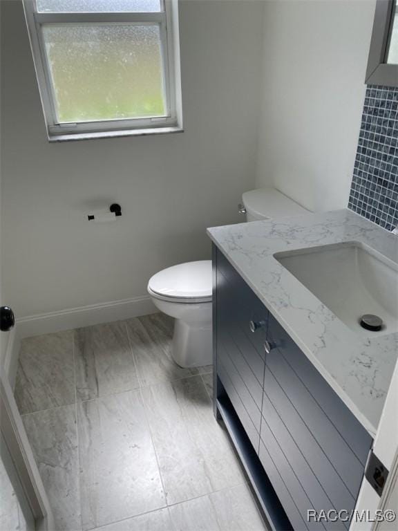 259 N Cherry Pop Dr, Inverness, FL 34453 - bathroom with vanity, toilet, and baseboards