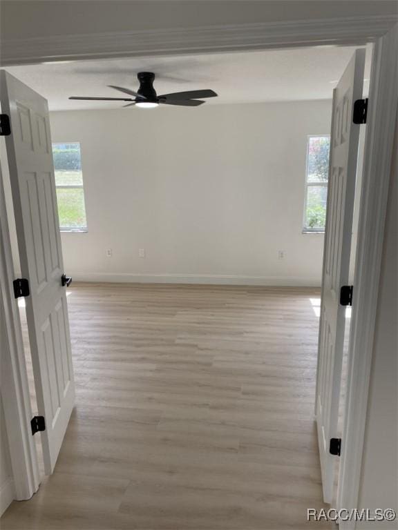 259 N Cherry Pop Dr, Inverness, FL 34453 - unfurnished room with ceiling fan, baseboards, and light wood-style flooring