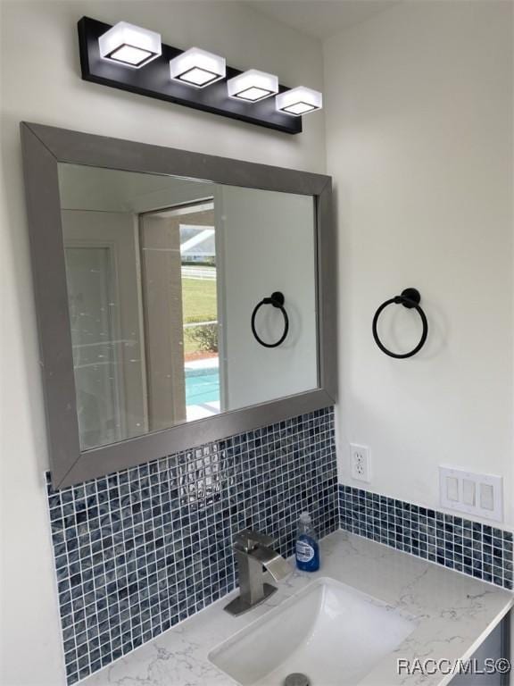 259 N Cherry Pop Dr, Inverness, FL 34453 - bathroom featuring decorative backsplash and vanity